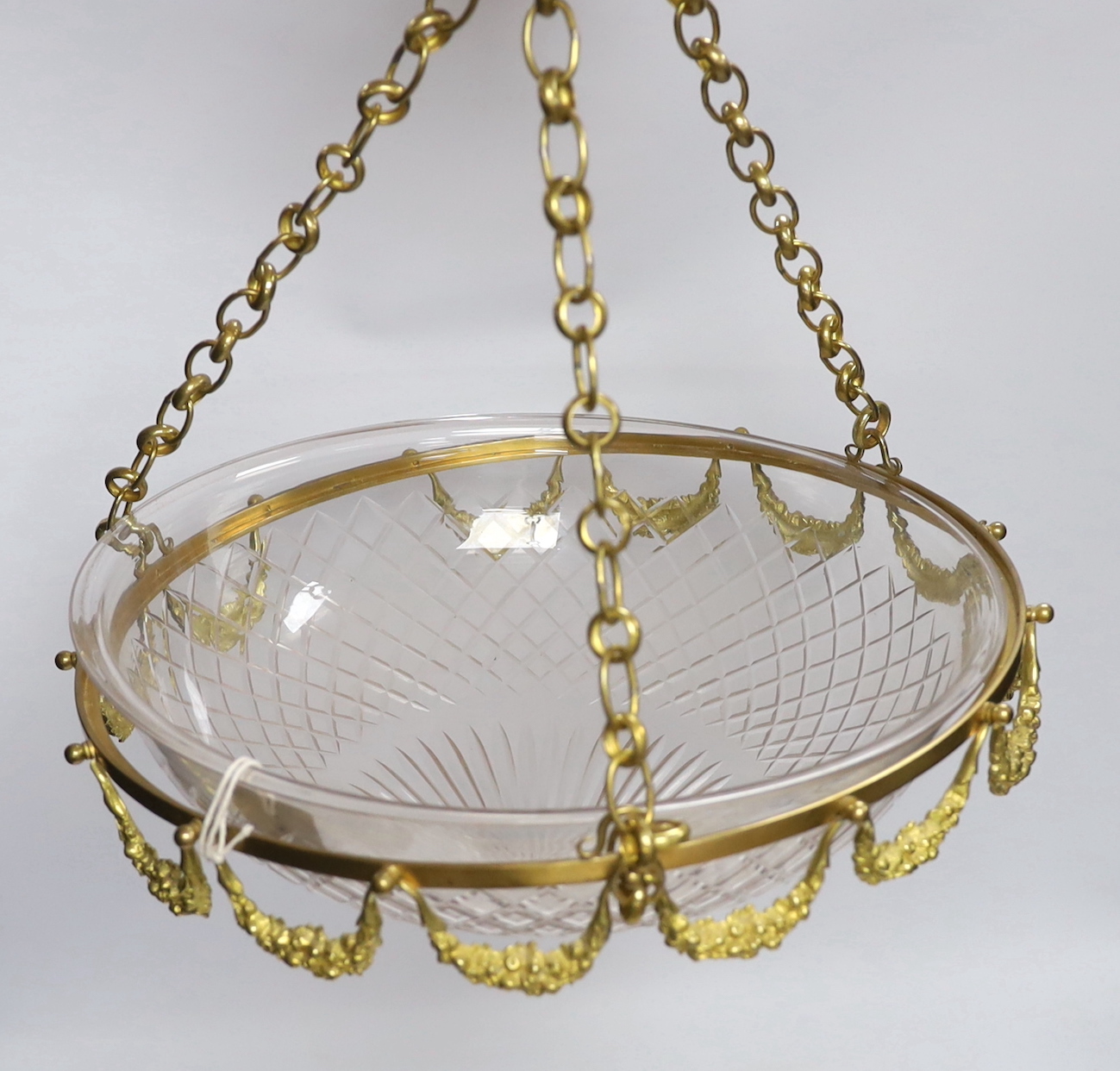 An early 20th century gilt metal and cut glass shade